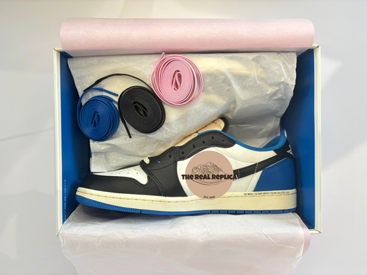 Box view of our replica J1 Retro Low - Fragments with white blue and black and cream colourway. pink black and blue laces. High quality replica designer trainers UK, best fake designer trainers UK, trainer dupes